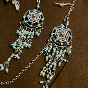 One necklace and two pair of earrings that match.